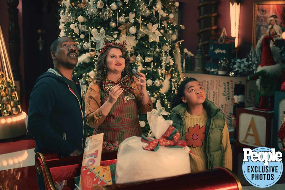 <p>CLAUDETTE BARIUS</p> Eddie Murphy, Jillian Bell and Madison Thomas in <em>Candy Cane Lane</em> (2023)