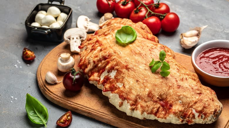 Calzone with mushrooms, tomatoes, basil 