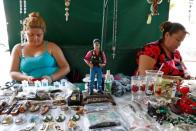 A statue depicting Mexican drug lord Joaquin "El Chapo" Guzman is pictured at a stall outside the "Saint Jesus Malverde" chapel in Culiacan