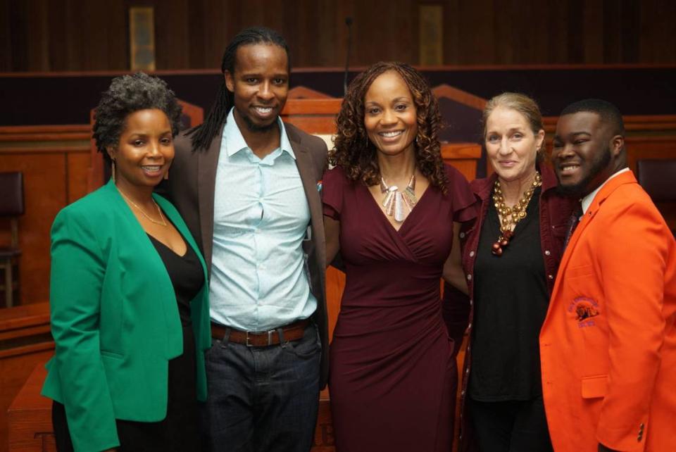 South Florida People of Color board chair Tameka Bradley Hobbs, left, and executive director Roni Bennett, center, pose with Ibram X. Kendi, the bestselling author of “How to be an Antiracist,” in Miami Gardens, Florida, on Sunday, Nov, 24, 2019. SFPoC is a nonprofit that seeks to eradicate racial prejudice through providing a platform for open, honest racial dialogue.