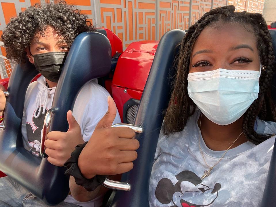 amber riding a rollercoaster at disneyland