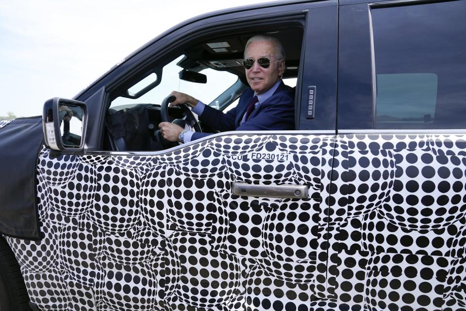 President Joe Biden, a self-described ‘car guy,’ drives a Ford F-150 Lightning electric truck on May 18, 2021, in Dearborn, Mich. <a href="https://newsroom.ap.org/detail/ElectricVehiclesFederalFleet/8d61a7311ee84326b163a1cbd0ac7219/photo" rel="nofollow noopener" target="_blank" data-ylk="slk:AP Photo/Evan Vucci;elm:context_link;itc:0;sec:content-canvas" class="link ">AP Photo/Evan Vucci</a>