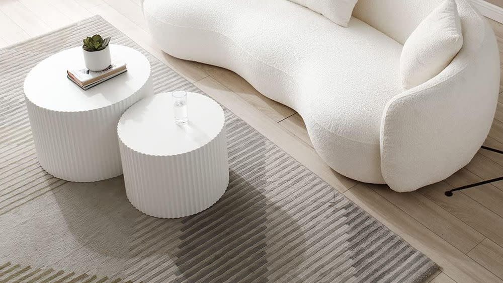 a white couch with a coffee table