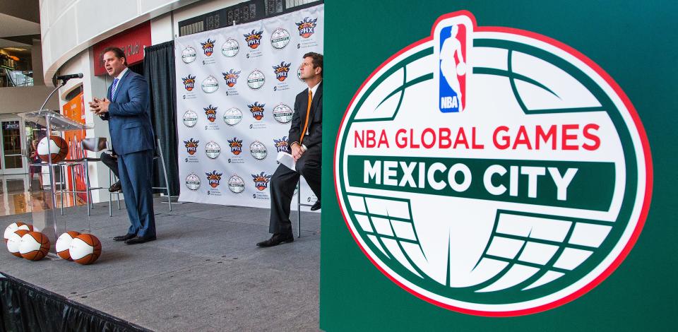 Phoenix Suns President Jason Rowley, left, announces that the team will take on the Dallas Mavericks and the San Antonio Spurs at a Mexico City arena on January 12 and 14, respectively.