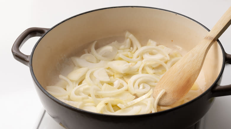 cooking onions in a pan