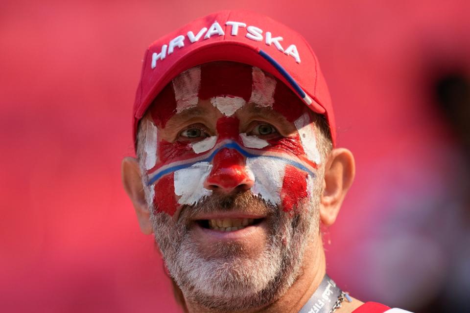 A Croatia supporter looks on prior to the World Cup group F football match between Morocco and Croatia, at the Al Bayt Stadium in Al Khor , Qatar, Wednesday, Nov. 23, 2022. (AP Photo/Themba Hadebe)