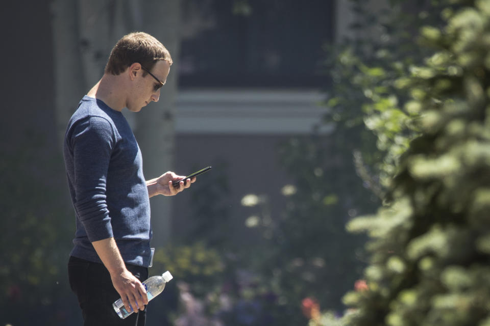 Mark Zuckerberg, chief executive officer of Facebook, checks his phone during the annual Allen & Company Sun Valley Conference, July 13, 2018 in Sun Valley, Idaho. (Photo: Drew Angerer/Getty Images)