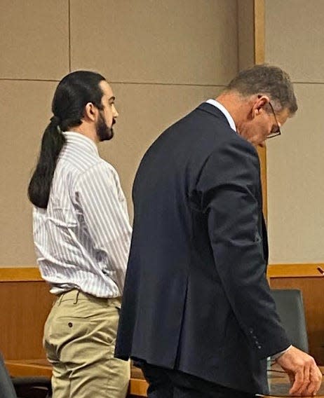 Ian Anselmo with defense attorney Richard Hornsby on Friday as they hear the jury verdict in Anselmo's murder trial.