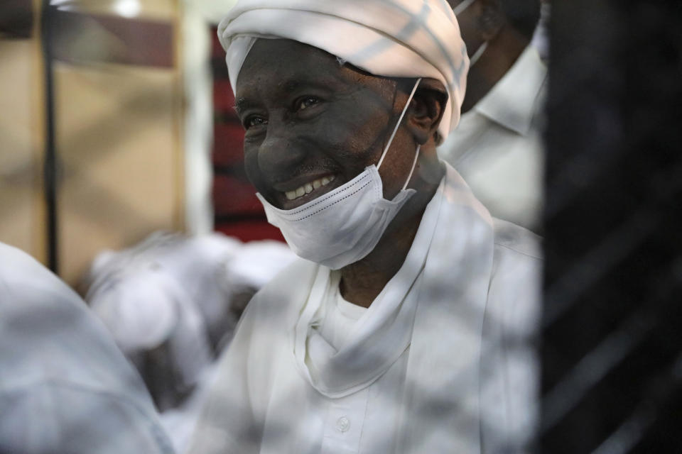 Former Sudanese vice president Ali Ossman Taha is behind bars during the trial of ousted Sudanese president Omar al-Bashir and over two dozen top officials in his government, in Khartoum, Sudan, Tuesday, July 21, 2020. The 76-year-old al-Bashir has been jailed in Khartoum since his ouster, facing several separate trials related to his rule and the uprising that helped oust him. Al-Bashir is also wanted by the International Criminal Court on charges of war crimes and genocide linked to the Darfur conflict in the 2000s. (AP Photo/Marwan Ali)