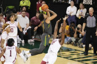 Baylor guard Keyonte George (1) drives to the basket and shoots over Arkansas forward Makhel Mitchell (22) in the first half of an NCAA college basketball game, Saturday, Jan. 28, 2023, in Waco, Texas. (Chris Jones/Waco Tribune-Herald via AP)