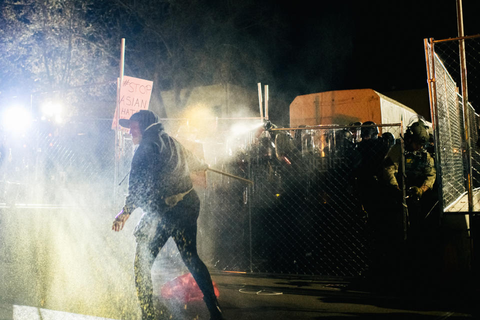 A demonstrator is pepper-sprayed outside police headquarters at Brooklyn Centre, Minnesota. Source: Getty