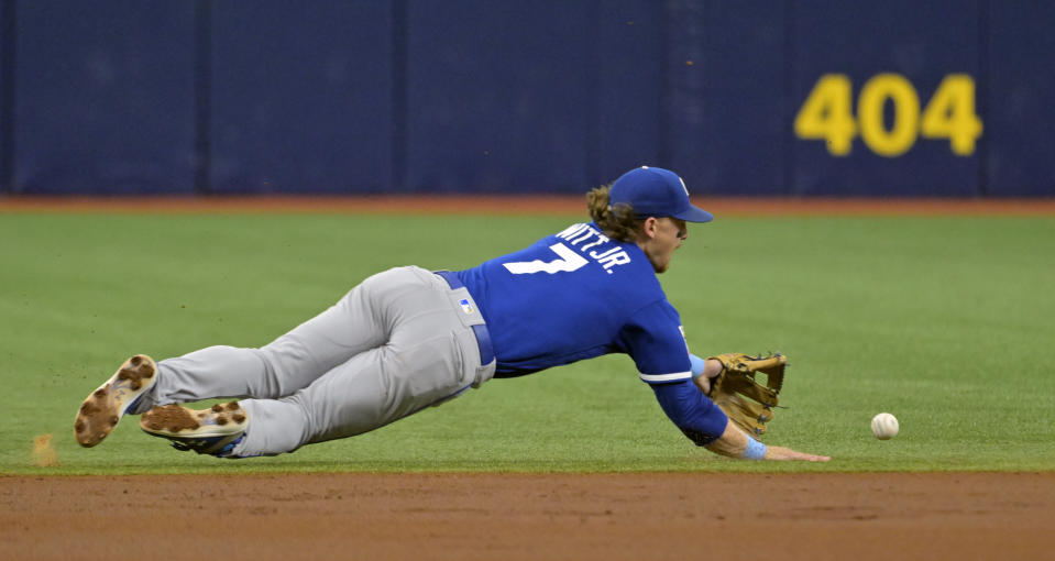 Kansas City Royals shortstop Bobby Witt Jr. knocks down an infield single hit by Tampa Bay Rays' Randy Arozarena during the first inning of a baseball game Saturday, June 24, 2023, in St. Petersburg, Fla. (AP Photo/Steve Nesius)