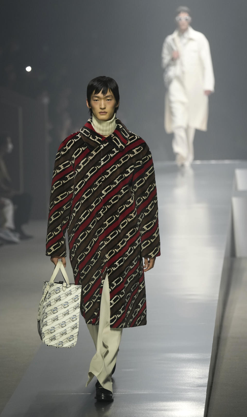 A model wears a creations for the Fendi fall winter 22/23 collection, in Milan, Italy, Saturday, Jan. 15, 2022. (AP Photo/Antonio Calanni)
