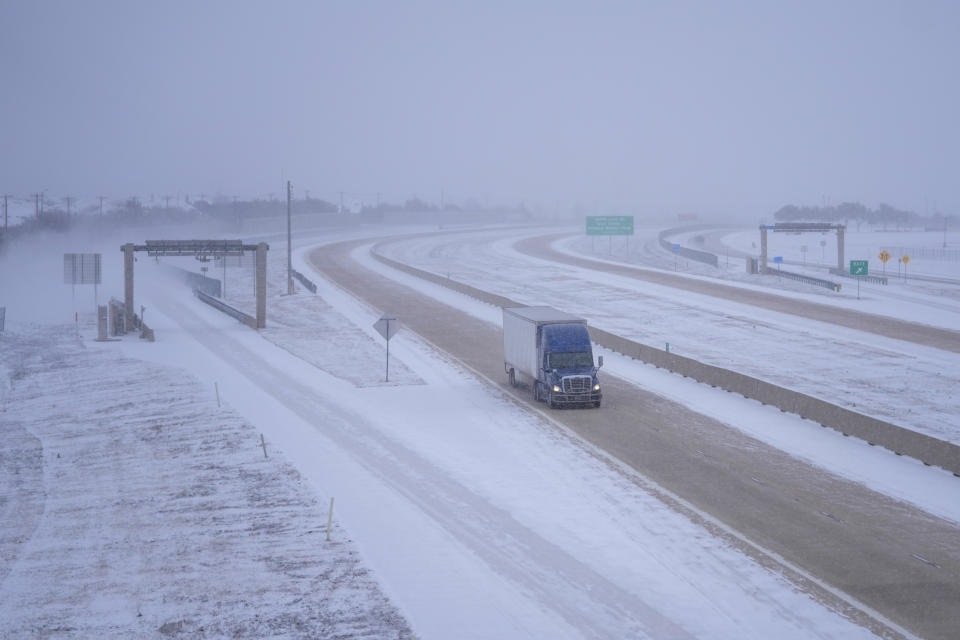 A truck drives southbound on State Highway 360 during a winter storm, Monday, Jan. 15, 2024, in Arlington, Texas. (AP Photo/Julio Cortez)