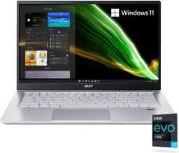 silver and black laptop with green swoop through the background