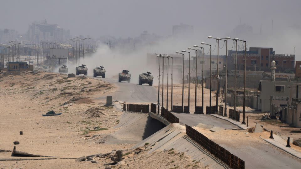 Israeli armored vehicles drive through Deir al-Balah, Gaza, on June 8.  - Abdel Kareem Hana/AP