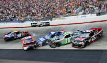 BRISTOL, TN - MARCH 18: Carl Edwards, driver of the #99 Cheez-It Ford, Kasey Kahne, driver of the #5 Farmers Insurance Chevrolet, Marcos Ambrose, driver of the #9 Mac Tools Ford, Kyle Busch, driver of the #18 Wrigley Toyota, and Kevin Harvick, driver of the #29 Budweiser Chevrolet, are involved in an incident during the NASCAR Sprint Cup Series Food City 500 at Bristol Motor Speedway on March 18, 2012 in Bristol, Tennessee. (Photo by John Harrelson/Getty Images for NASCAR)