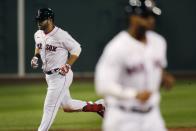 Boston Red Sox's Mitch Moreland rounds the bases on his two-run home run that also drove in Xander Bogaerts, right, during the third inning of a baseball game against the Toronto Blue Jays, Friday, Aug. 7, 2020, in Boston. (AP Photo/Michael Dwyer)