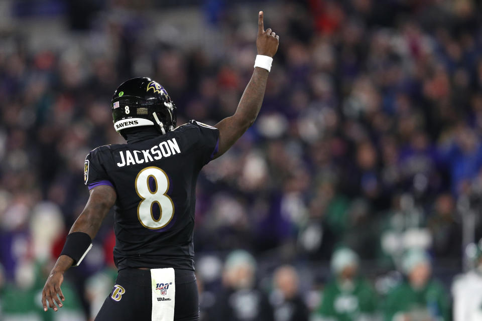 BALTIMORE, MARYLAND - DECEMBER 12: Quarterback Lamar Jackson #8 of the Baltimore Ravens celebrates after a touchdown in the first quarter of the game against the New York Jets at M&T Bank Stadium on December 12, 2019 in Baltimore, Maryland. (Photo by Patrick Smith/Getty Images)