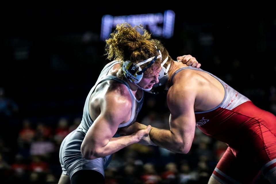 Central Oklahoma's Dalton Abney, left, wrestles Indianapolis' Derek Blubaugh at 197 pounds in the finals during the NCAA Division II Wrestling Championships, Saturday, March 11, 2023, at Alliant Energy PowerHouse in Cedar Rapids, Iowa.