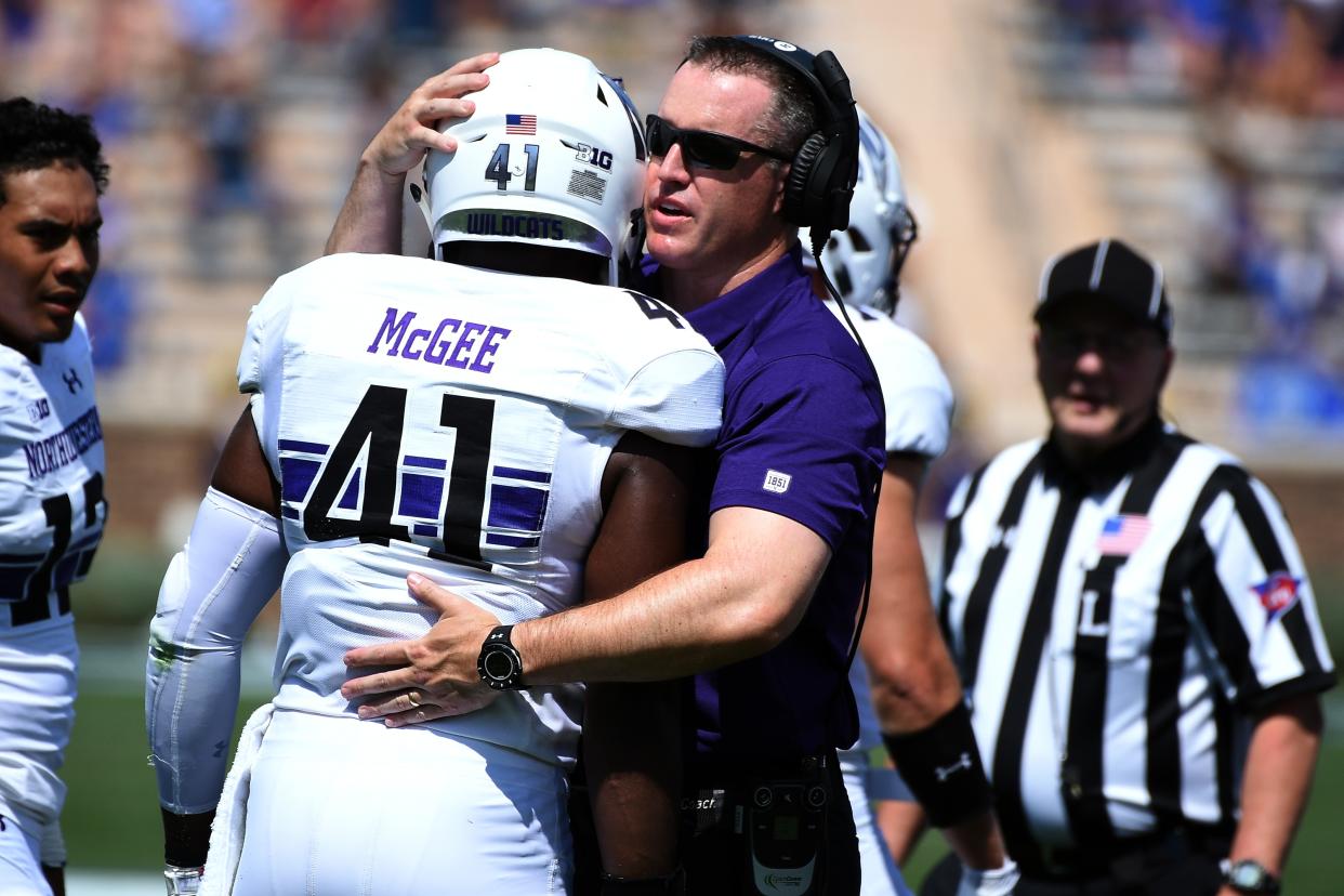 DURHAM, NC – SEPTEMBER 09: Head coach Pat Fitzgerald of the Northwestern Wildcats talks with Jared McGee #41 following a targeting call and ejection on McGee during their game against the Duke Blue Devils at Wallace Wade Stadium on September 9, 2017 in Durham, North Carolina. (Photo by Lance King/Getty Images)