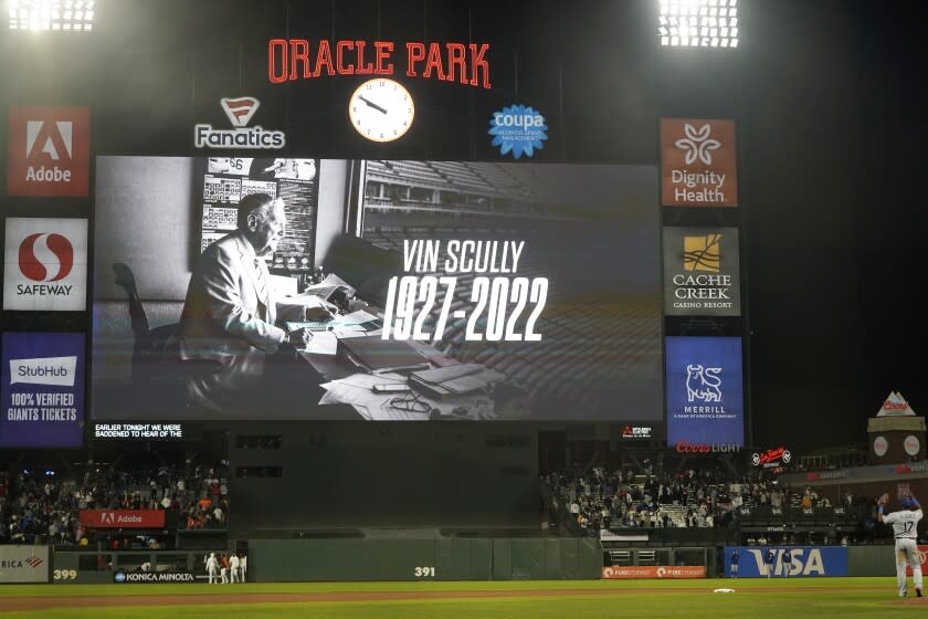 The scoreboard at Oracle Park shows a message for broadcaster Vin Scully after the Los Angeles Dodgers defeated the San Francisco Giants in a baseball game in San Francisco, Tuesday, Aug. 2, 2022. (AP Photo/Jeff Chiu)