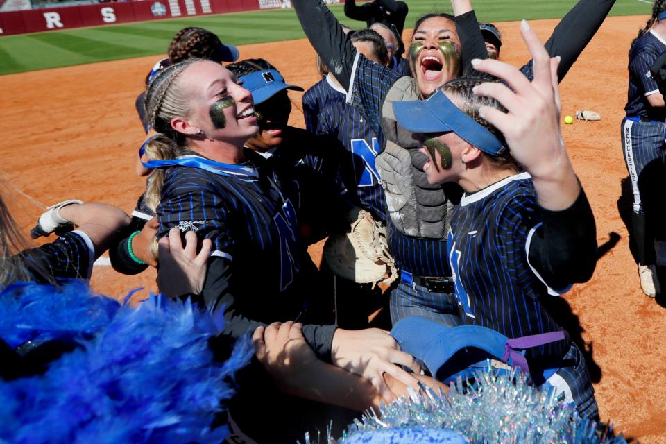 Newcastle's Brooklyn Lyles celebrates with her teammates after the Racers won the Class 4A fastpitch softball championship, 4-0 against Purcell on Oct. 14.
