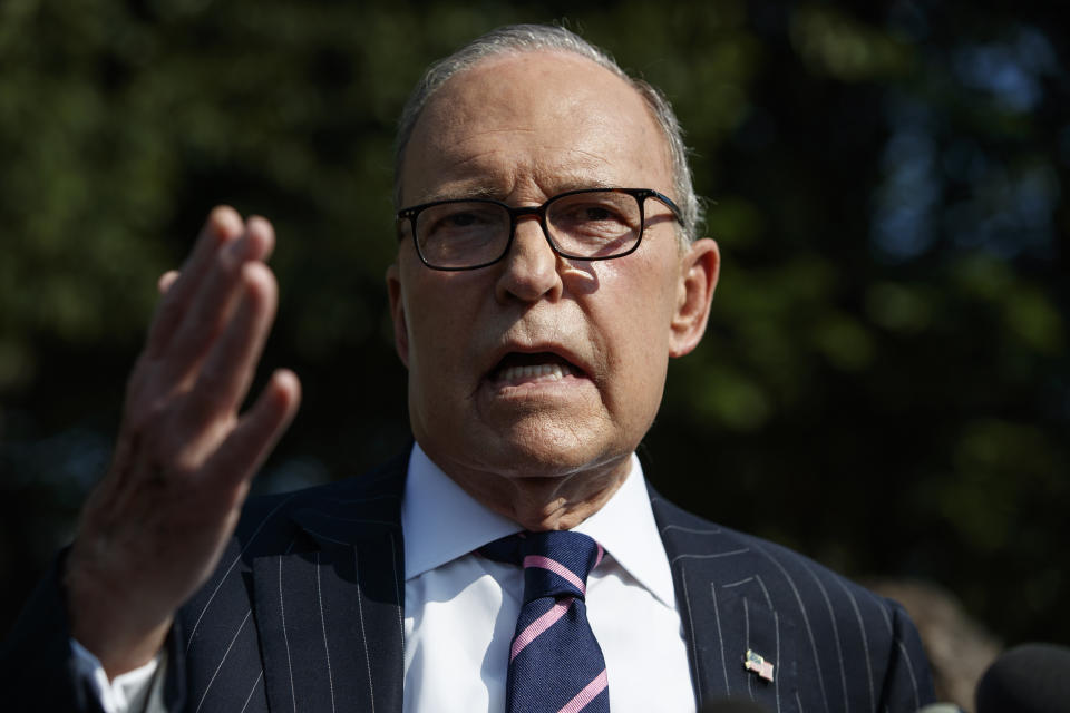 FILE - In this Aug. 6, 2019, file photo, White House chief economic adviser Larry Kudlow talks with reporters outside the White House in Washington. Where past presidents have relied on top academics, business leaders and officials with experience in prior administrations, Trump has gone a different route. He’s built crew of camera-ready economic advisers, rather than one known for its policy chops. (AP Photo/Evan Vucci, File)