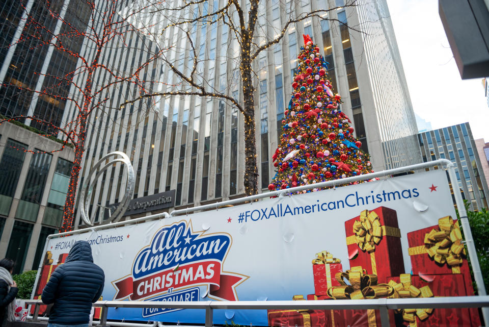 An "All American Christmas at Fox Square" sign near Christmas decorations in front of the News Corporation building in New York City. Fox News hosts are arguing this year that measures to curb the spread of COVID-19 are part of the left's so-called "war on Christmas."  (Photo: Alexi Rosenfeld via Getty Images)