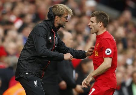 Britain Football Soccer - Liverpool v Hull City - Premier League - Anfield - 24/9/16 Liverpool's James Milner with manager Juergen Klopp Action Images via Reuters / Andrew Boyers Livepic