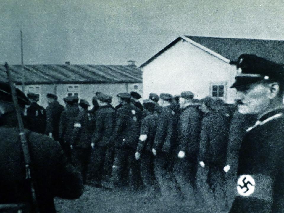 Prisoners enter Dachau concentration camp in 1933.