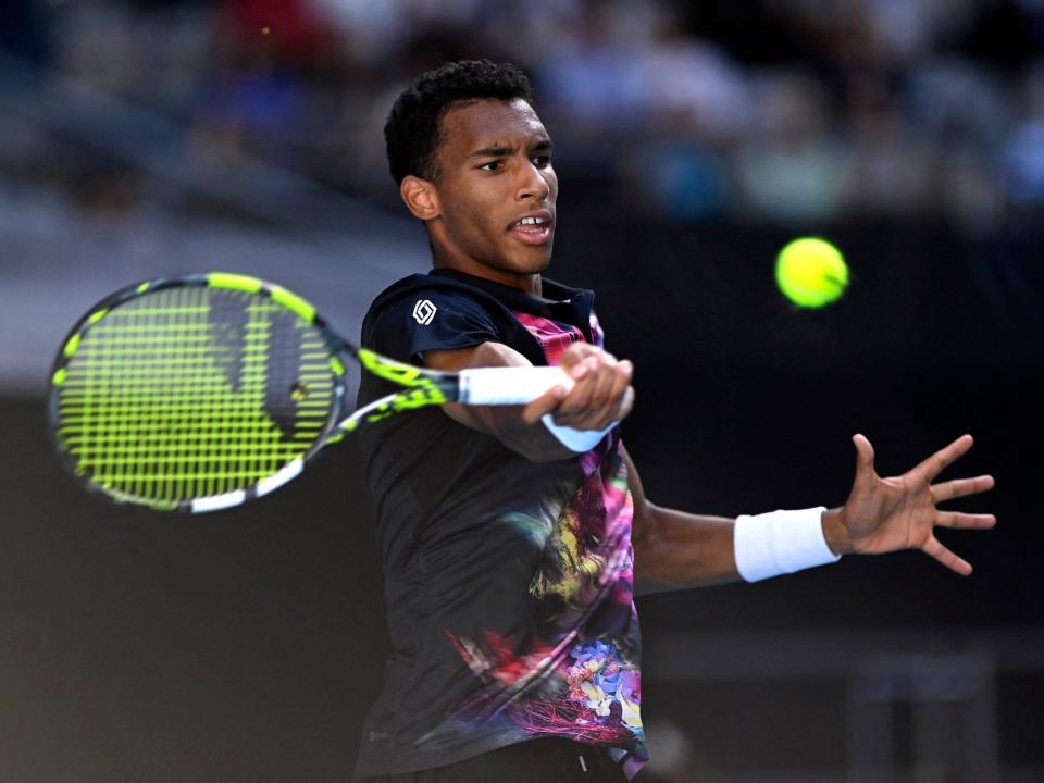 Felix Auger-Aliassime competes in the third round of the 2023 Australian Open.