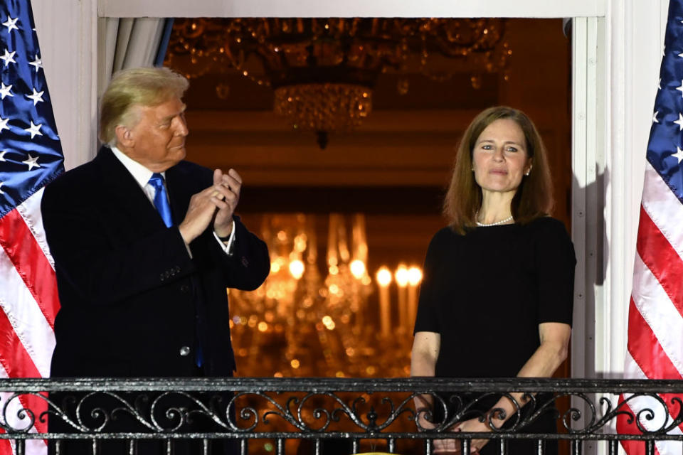 US President Donald Trump applauds Judge Amy Coney Barrett after her swearing in. Source: Getty