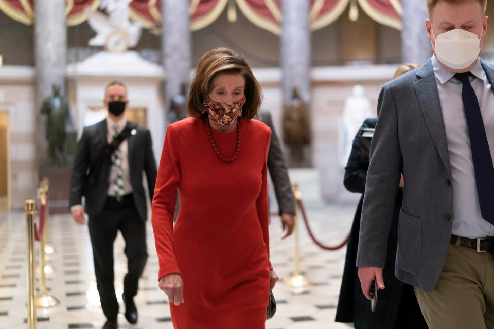 Speaker of the House Nancy Pelosi, D-Calif., walks to the chamber to condemn the actions of Rep. Paul Gosar, R-Ariz., who tweeted an animated video that depicted him striking Rep. Alexandria Ocasio-Cortez, D-N.Y., with a sword, on Capitol Hill in Washington, on Nov. 17, 2021.