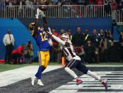 <p>Wide receiver for the Los Angeles Rams Brandin Cooks (L) catches the ball during Super Bowl LIII between the New England Patriots and the Los Angeles Rams at Mercedes-Benz Stadium in Atlanta, Georgia, on February 3, 2019. (Photo by TIMOTHY A. CLARY / AFP) </p>