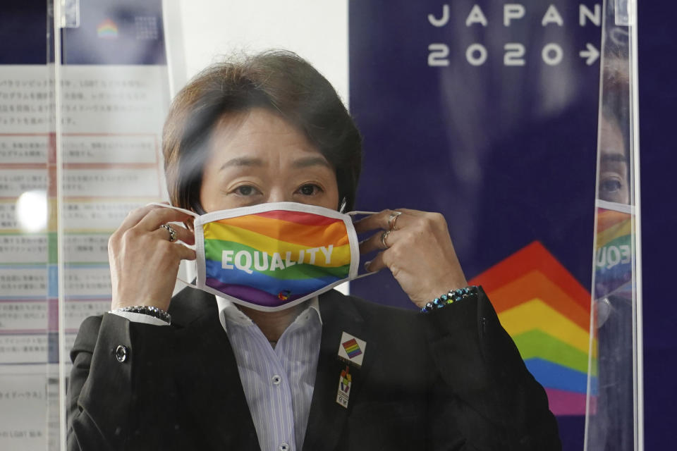 Tokyo 2020 Organizing Committee President Seiko Hashimoto wears a rainbow-colored mask with word "Equality" during her visit to Pride House Tokyo Legacy in Tokyo Tuesday, April 27, 2021. Japan marked LGBTQ week with pledge to push for equality law before the Olympics. (AP Photo/Eugene Hoshiko, Pool)