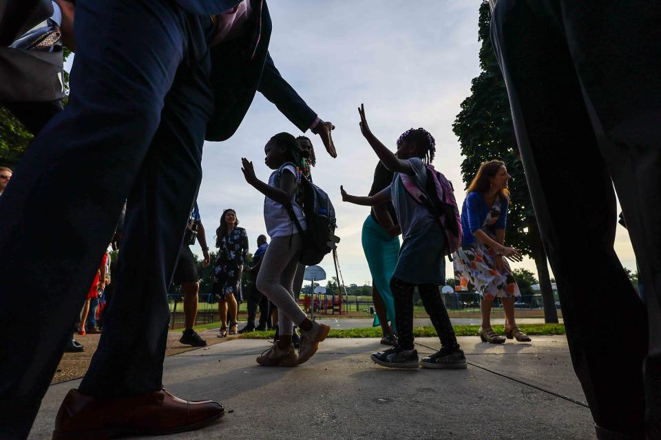 Members of the community along with local elected officials greeted students as they arrive for the first day school on Tuesday September 5, 2023 at EastSide Charter School in Wilmington.