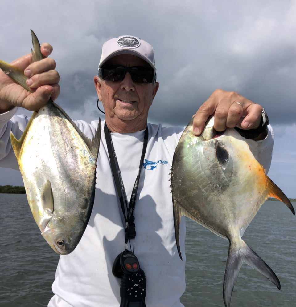 Art Mowery with a pair of pompano he caught this week in the Indian River.