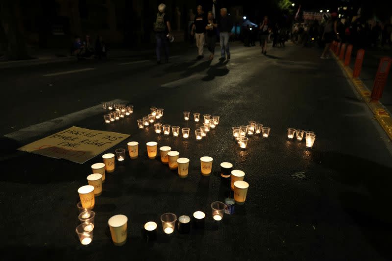 FILE PHOTO: Candles are seen during a vigil for the people killed and injured in a stampede at an ultra-Orthodox Jewish festival on the slopes of Israel's Mount Meron, in Jerusalem