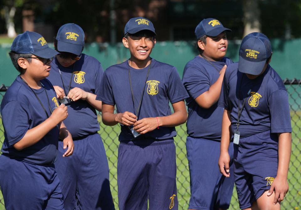 Dover, NJ August 1, 2023 -- Members of the Dover Junior Police Academy during drill instruction during their day of training. Over 30 kids assembled at the American Legion hall, then marched to nearby Crescent Field for training.