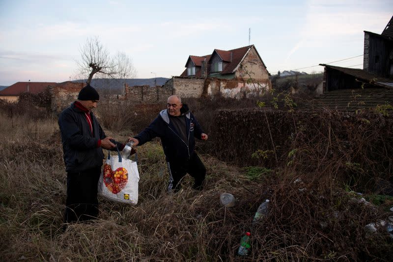 The Wider Image: Hungary's poor burn plastic bottles to stay warm, creating deadly smog