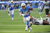 Los Angeles Chargers running back Austin Ekeler scores a touchdown past Cleveland Browns free safety John Johnson (43) during the second half of an NFL football game Sunday, Oct. 10, 2021, in Inglewood, Calif. (AP Photo/Kevork Djansezian)