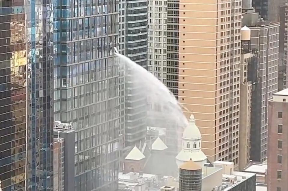 A torrent of water was seen spewing from an NYC high-rise. Citizen
