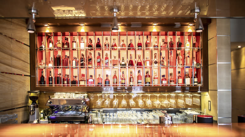 Bottles on display behind bar