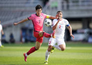 South Korea's Son Heung-min, left, fights for the ball against Lebanon's Kassem El Zein during their Asian zone Group H qualifying soccer match for the FIFA World Cup Qatar 2022 at Goyang stadium in Goyang, South Korea, Sunday, June 13, 2021. (AP Photo/Lee Jin-man)