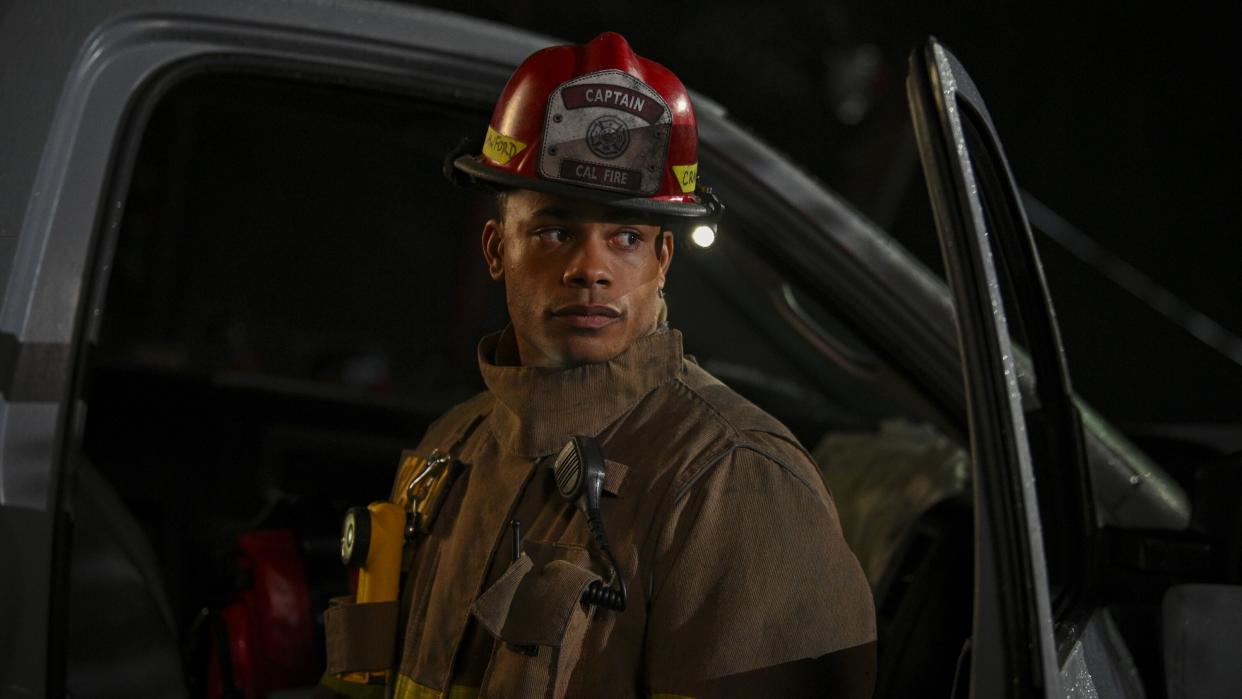  Jordan Calloway as Jake Crawford in firefighting gear in Fire Country season 2. 