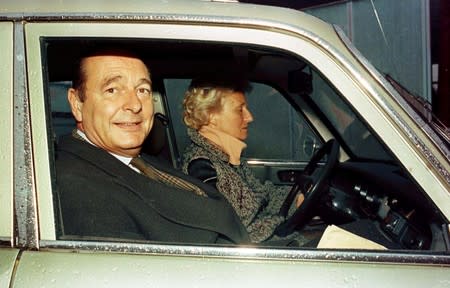 FILE PHOTO: Jacques Chirac, French RPR party President and Paris' mayor, and his wife Bernadette are seen in a Peugeot 304 car during a visit in Sarran