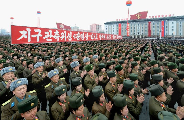 North Korean people and soldiers celebrating a report on North Korea's rocket launch in Pyongyang on February 8, 2016