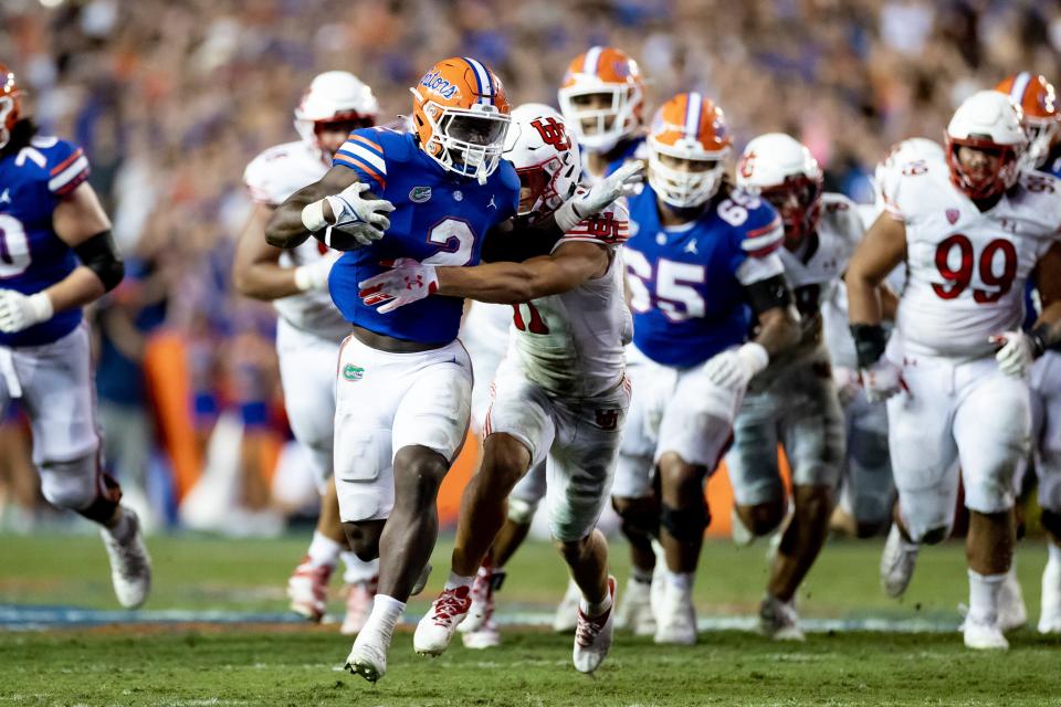 Florida Gators running back Montrell Johnson Jr. (2) rushes with the ball during the second half against the Utah Utes at Steve Spurrier Field at Ben Hill Griffin Stadium in Gainesville, FL on Saturday, September 3, 2022. [Matt Pendleton/Gainesville Sun]