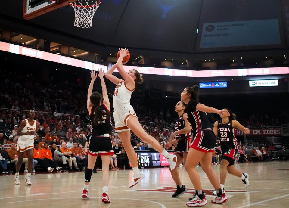 Texas forward Taylor Jones puts up a shot over Texas Tech defenders in Wednesday night's 77-72 win at Moody Center. Jones finished with 19 points, her best effort in a Big 12 game this season.